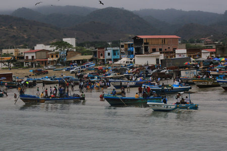 Puerto Lopez Ecuador, 9-7-2019: A busy morning bringing in the days catch in the fisherman villageのeditorial素材