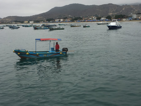 Puerto Lopez, Ecuador, 9-7-2019: A fishersman boat driving out of the habourのeditorial素材