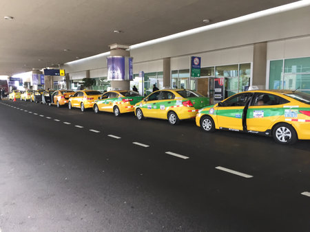 Quito, Ecuador - 14-7-2019: Many yellow official taxis lined up and waiting for passengersのeditorial素材