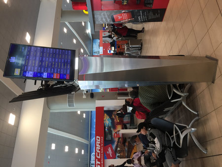 Quito, Ecuador - 14-7-2019: The inside of an airport showing flight details next to a waiting roomのeditorial素材