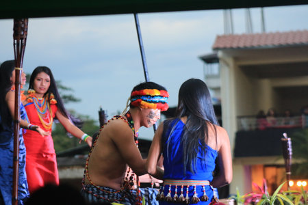Puyo, Ecuador, 17-8-2019: An indigenous tribe called shuar performing their dance in traditional clothing and spearsのeditorial素材