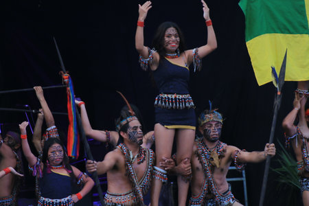 Puyo, Ecuador, 17-8-2019: woman and man of an indigenous tribe called shiwuar performing a dance in traditional clothsのeditorial素材