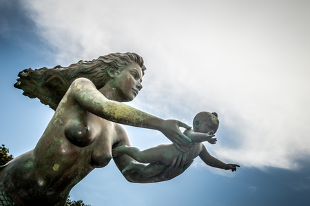 Mermaid statues and child on Koh Sametのeditorial素材