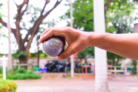 In the morning, the air was cool, the man was practicing throwing the boule. At the boulevard They work on their own. Enjoy and have fun. Petanque started in Thailand in 1965 and has been playing to this day. Exercise Good for the elderly It has always been promoted.の写真素材