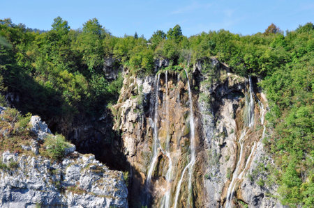 Falling waterfalls from high rock in the nature reserve of Plitvice Lake.の写真素材