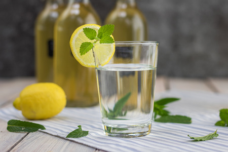 Home made lemonade in a glass   with mint syrup and lemon sliceの写真素材