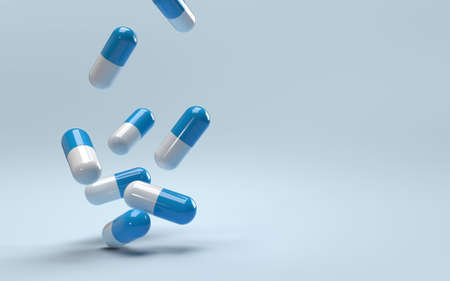 Falling pills on a blue background. Antibiotics. 3D render.の写真素材