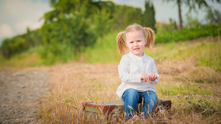 Little girl traveling around the countrysideの写真素材