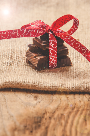 Chocolate with ribbon and heart on St. Valentine's day love.の写真素材