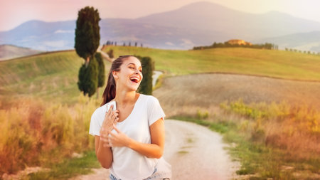 Smiling beautiful girl on vacation in Tuscany, Italy.の写真素材