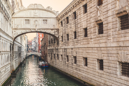 Gondolas on the canal Bridge of Sighs (ponte dei sospiri) in Venice. In fact bridge of sighs, who took last breath freedom of losing on the gallows.の写真素材
