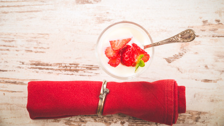 Fluffy and full of vitamins healthy strawberries on white wooden rustic table.の写真素材