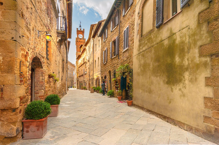 Beautiful and colorful streets of the small and historic Tuscan village Pienza, Italyの写真素材
