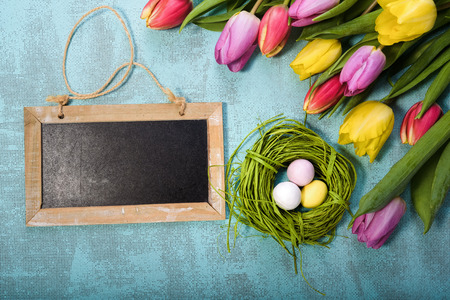 Easter and spring background with tulips and eggs.の写真素材