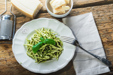 Trofie pasta with vegetarian sauce, pesto with pine nuts and basyli.の写真素材