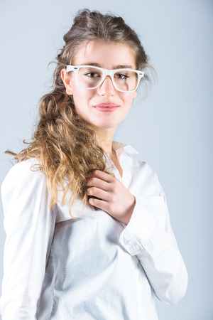 Cute young successful woman in glasses, female boss.の写真素材