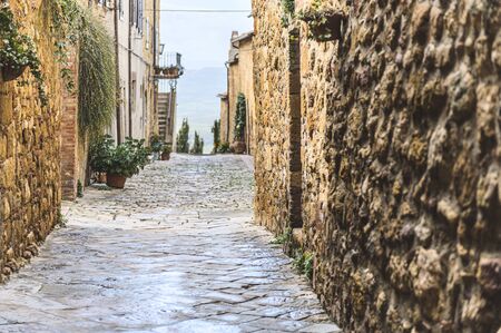 Walk on a rainy day through the streets of the beautiful town, Pienza, Tuscanyの写真素材