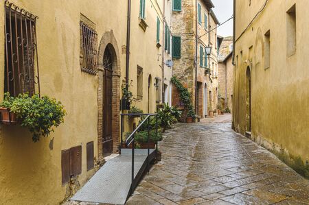 Walk on a rainy day through the streets of the beautiful town, Pienza, Tuscanyの写真素材