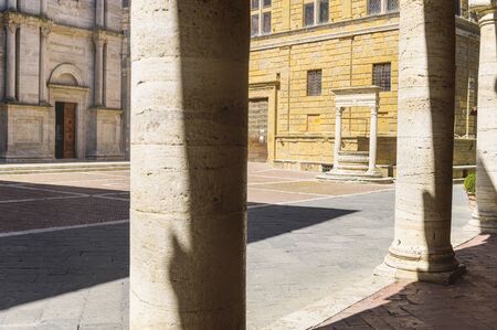 Sunny streets with colorful flowers with contrasting shades. Walk the Tuscan townの写真素材