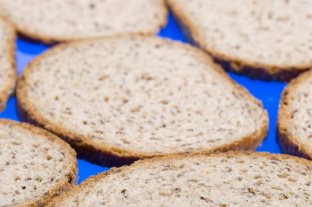 Brown bread slices on blue background