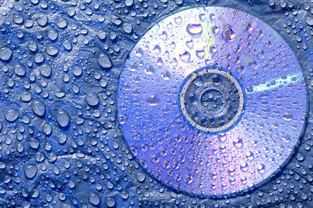 Water droplets on black plastic material with CD disk
の写真素材