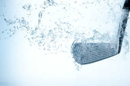 Golf club in blue water. Club and bubblesの写真素材
