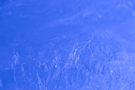 Background with  blue water. Creative splashing