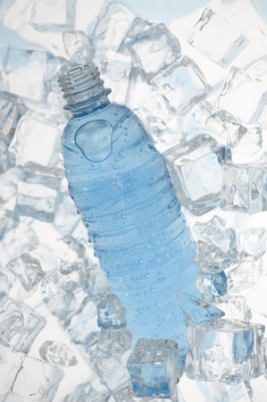 Mineral water with ice. Blue background with plastic bottle
の写真素材