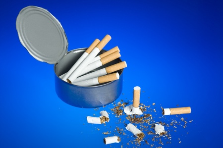 Cigarette on blue background. Cood for anti smoking issuesの写真素材