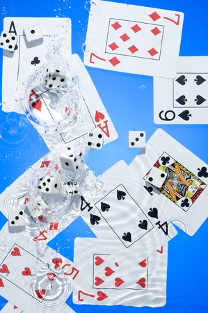 Several dice combination and playing cards on waterのeditorial素材