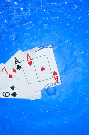 Several dice combination and playing cards on waterの写真素材