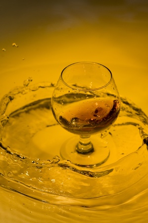 Class of brandy on creative brown background with water
の写真素材