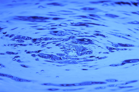 Background with blue water. Creative splashing