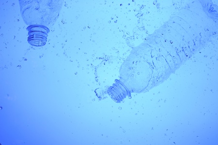 Background with Plastic bottle in blue waterの写真素材