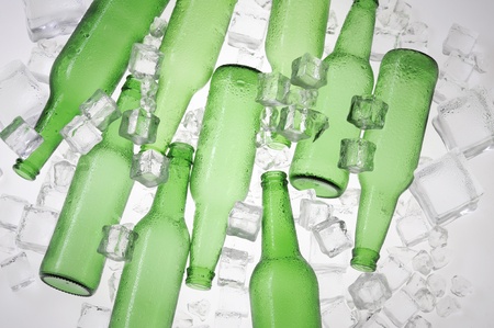 Green beer bottles and clear ice の写真素材