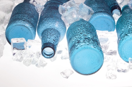 Blue creative bottles and clear ice .Cocktail with ice
の写真素材
