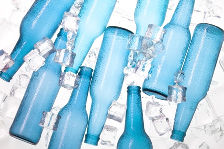 Blue creative bottles and clear ice .Cocktail with iceの写真素材