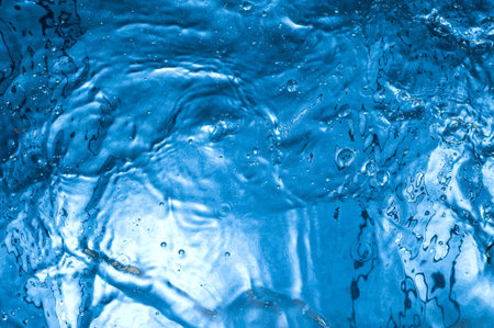 Dark water surface with bubbles