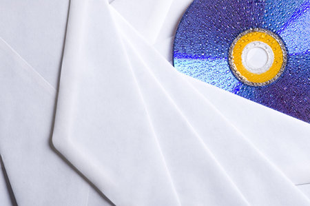 CD disk with envelope on the desk