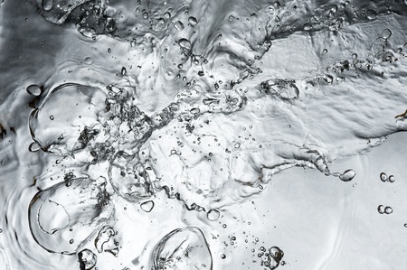 Black water surface with bubblesの写真素材