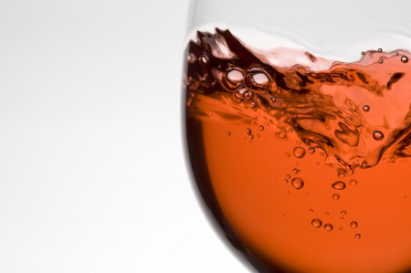 Splashing red wine.Pouring wine