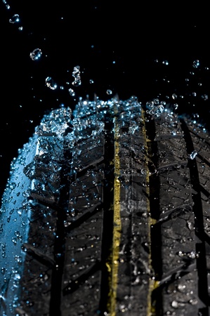 Tire with water drops on it black background
の写真素材