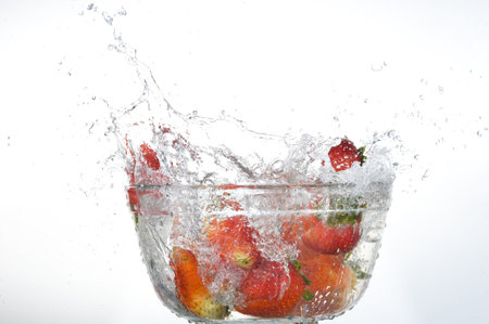 Red Strawberries  splashing in fresh water
