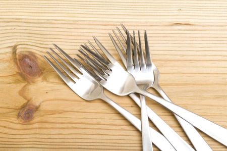 Background with silverware. Kitchen utensil on wood background
の写真素材