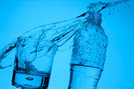 In a glass the fresh stream of water flows