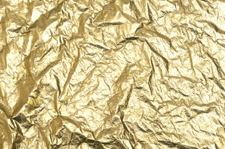 Gold background with metallic foilの写真素材