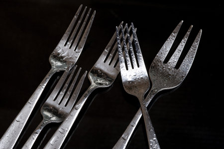 Fork on the black background