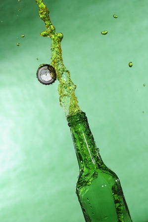 Open beer bottle with stream fresh drinkの写真素材