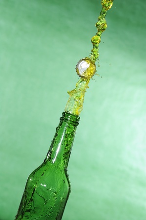 Open beer bottle with stream fresh drinkの写真素材