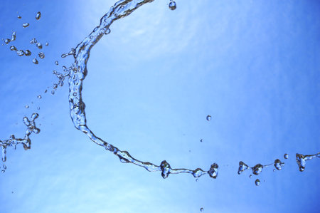 Splashing fresh blue water. Background aqua drop.